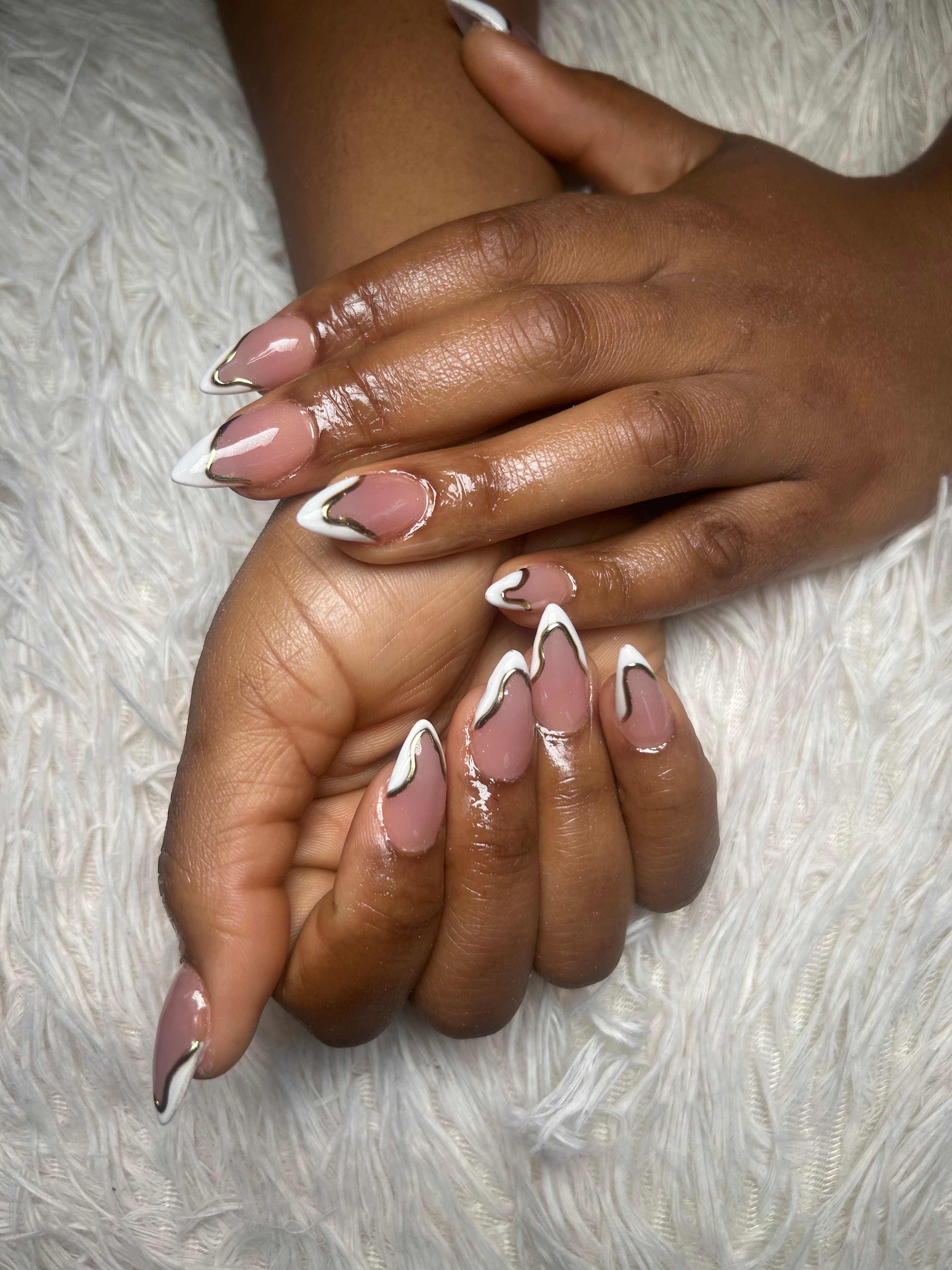 A soft pink and white French nail set by Nails by Mo Gems